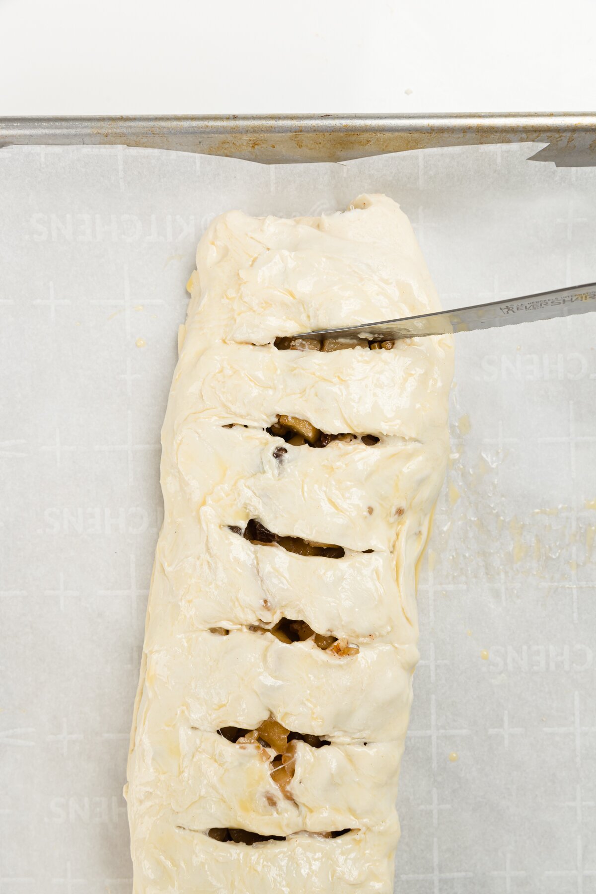 Cutting slits into rolled puff pastry