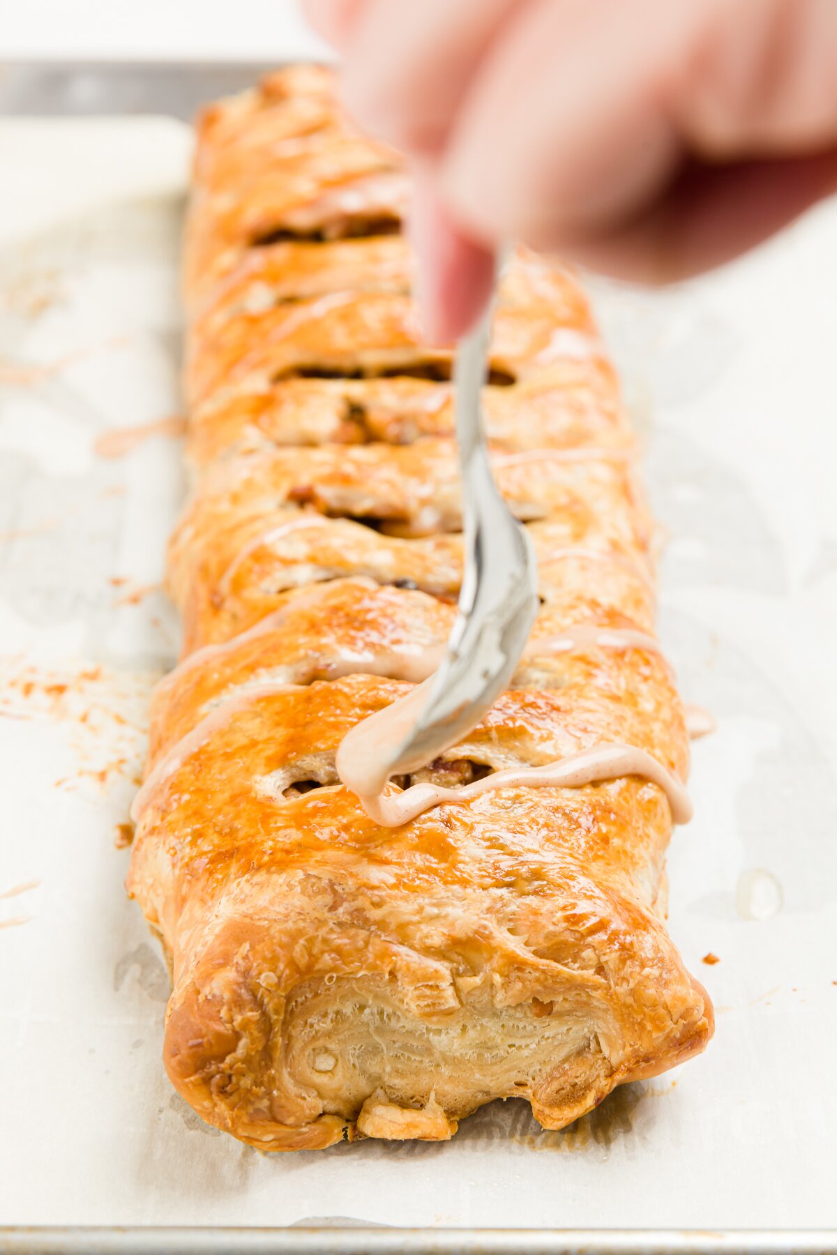 Drizzling glaze on strudel 