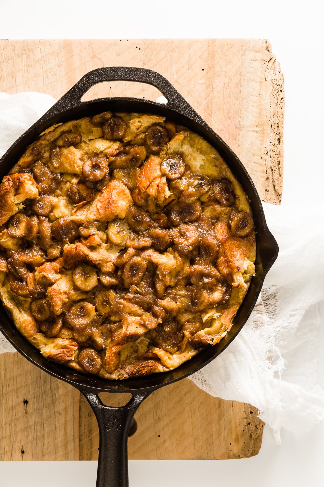 Overnight Bananas Foster baked French toast in a skillet