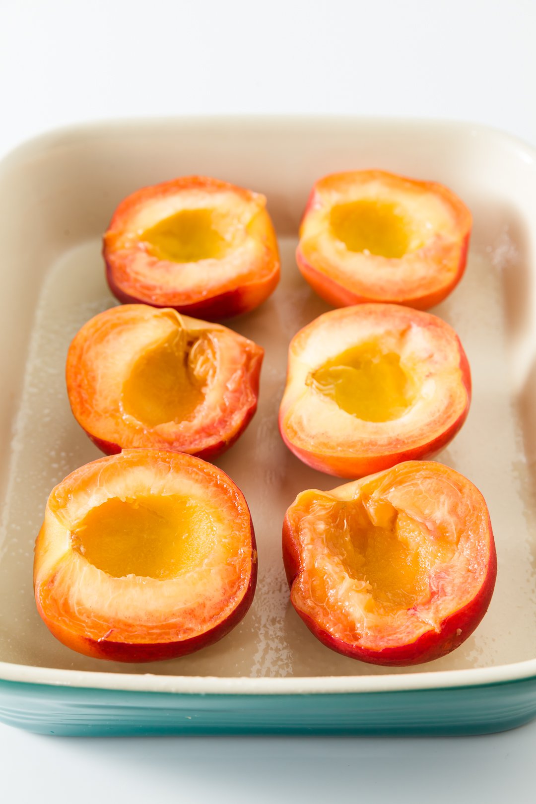 Sliced peaches in a baking dish