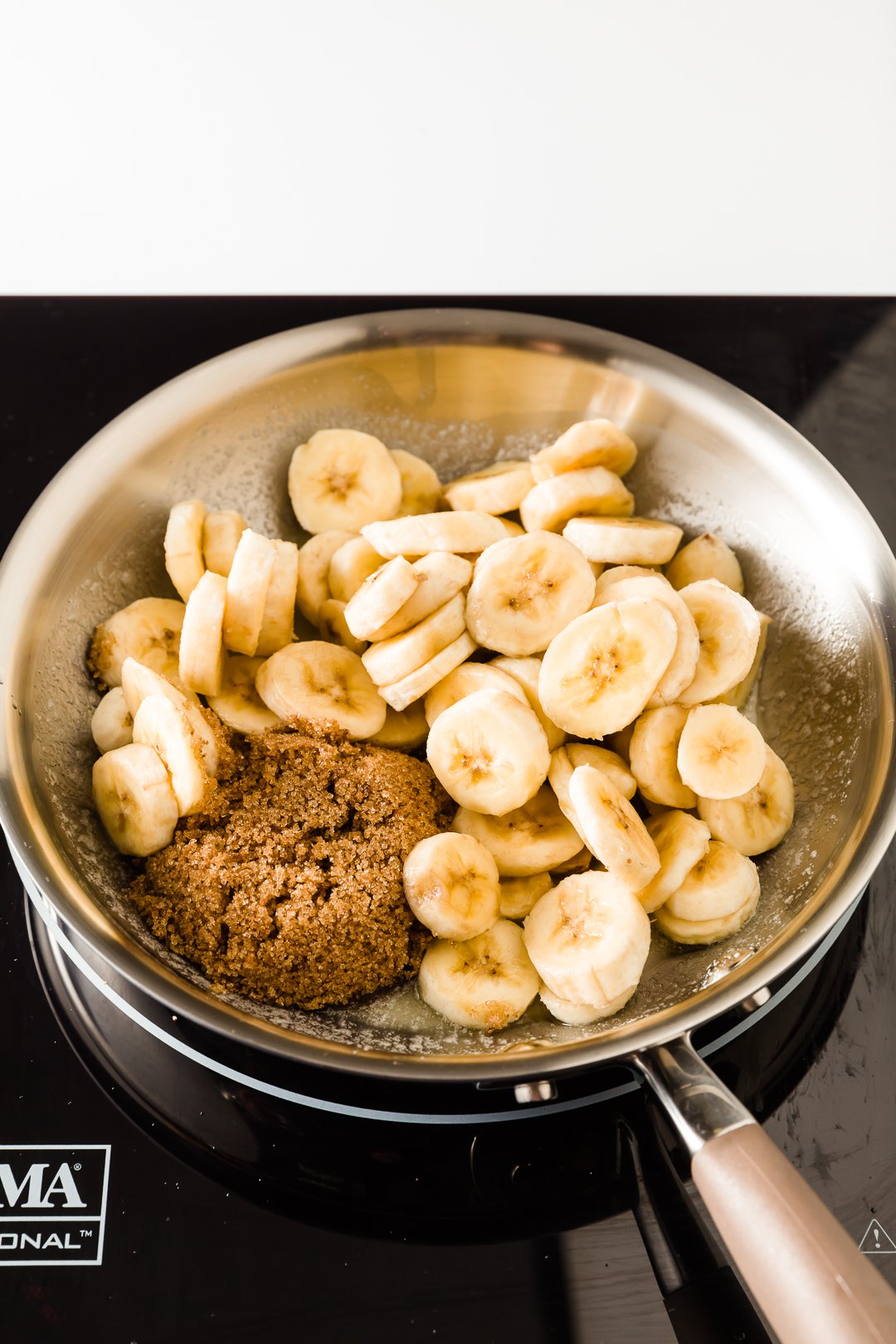Brown sugar and sliced bananas in a skillet