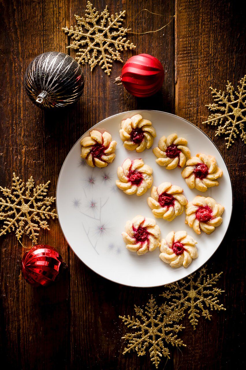 Spritz Cookies on a plate decorated for Christmas