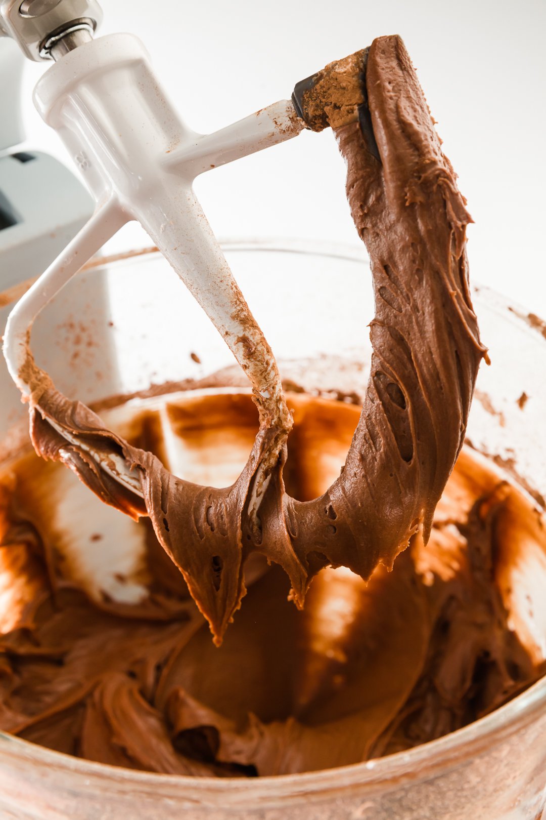 Chocolate cream cheese frosting on a beater