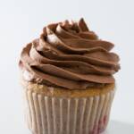 Chocolate whipped cream on cupcake