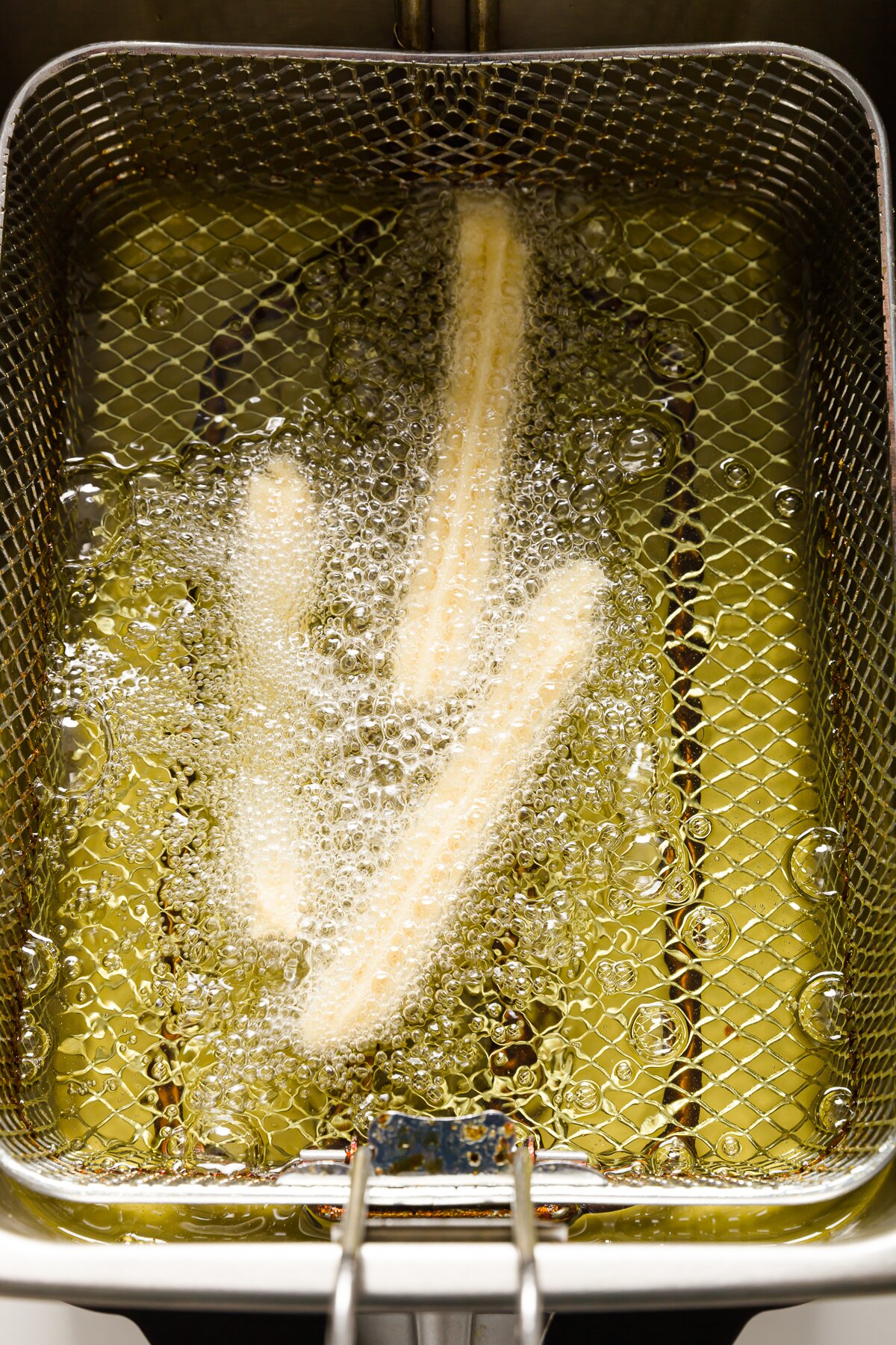 Churros in a deep fryer