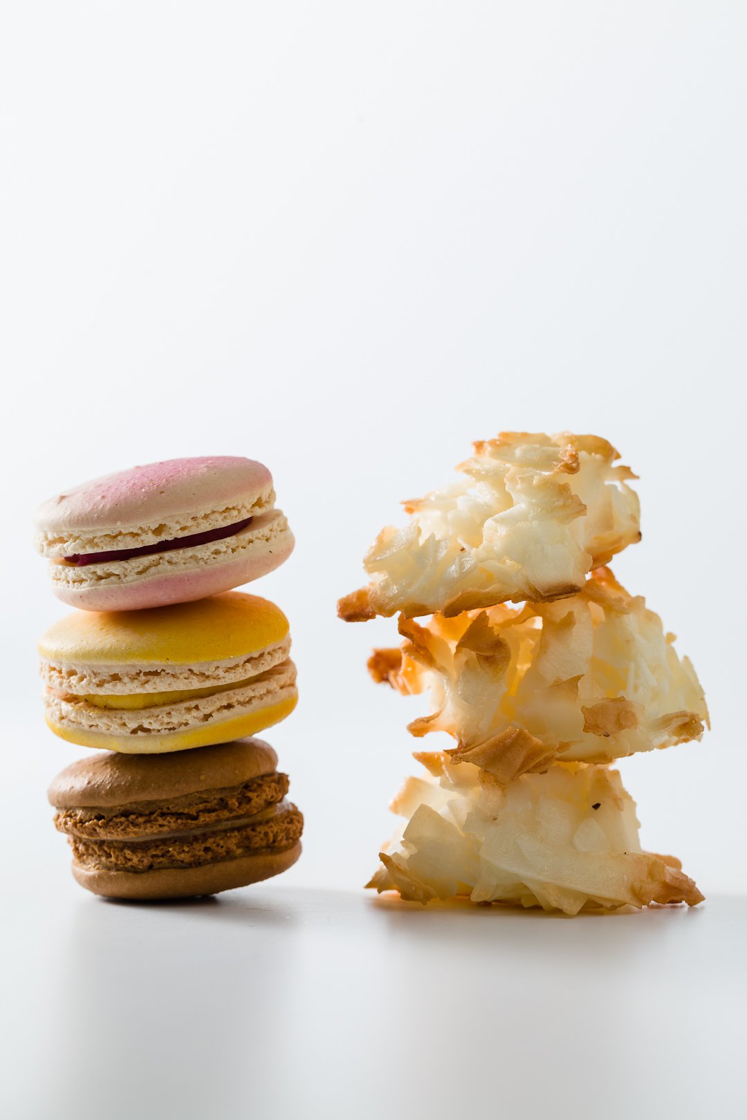 A stack of macarons and a stack of macaroons