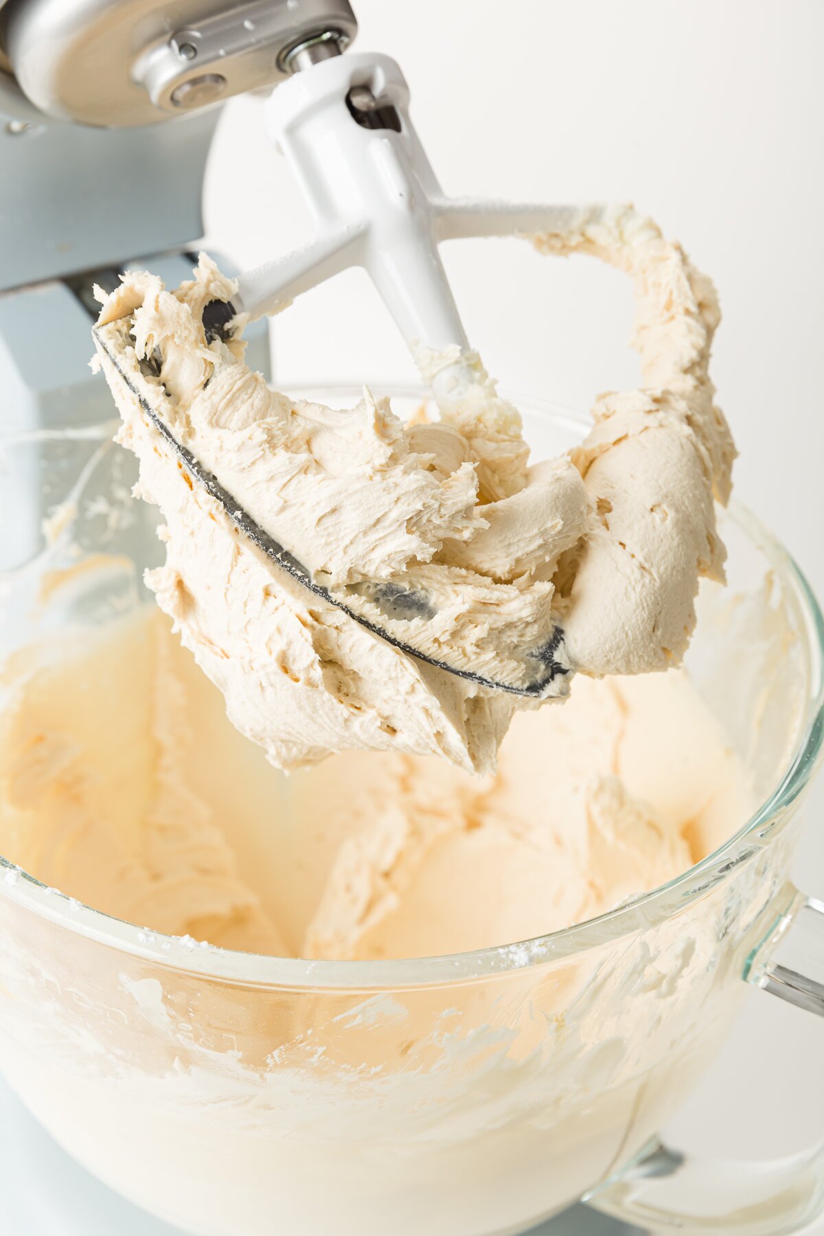 Coffee frosting on a raised beater blade