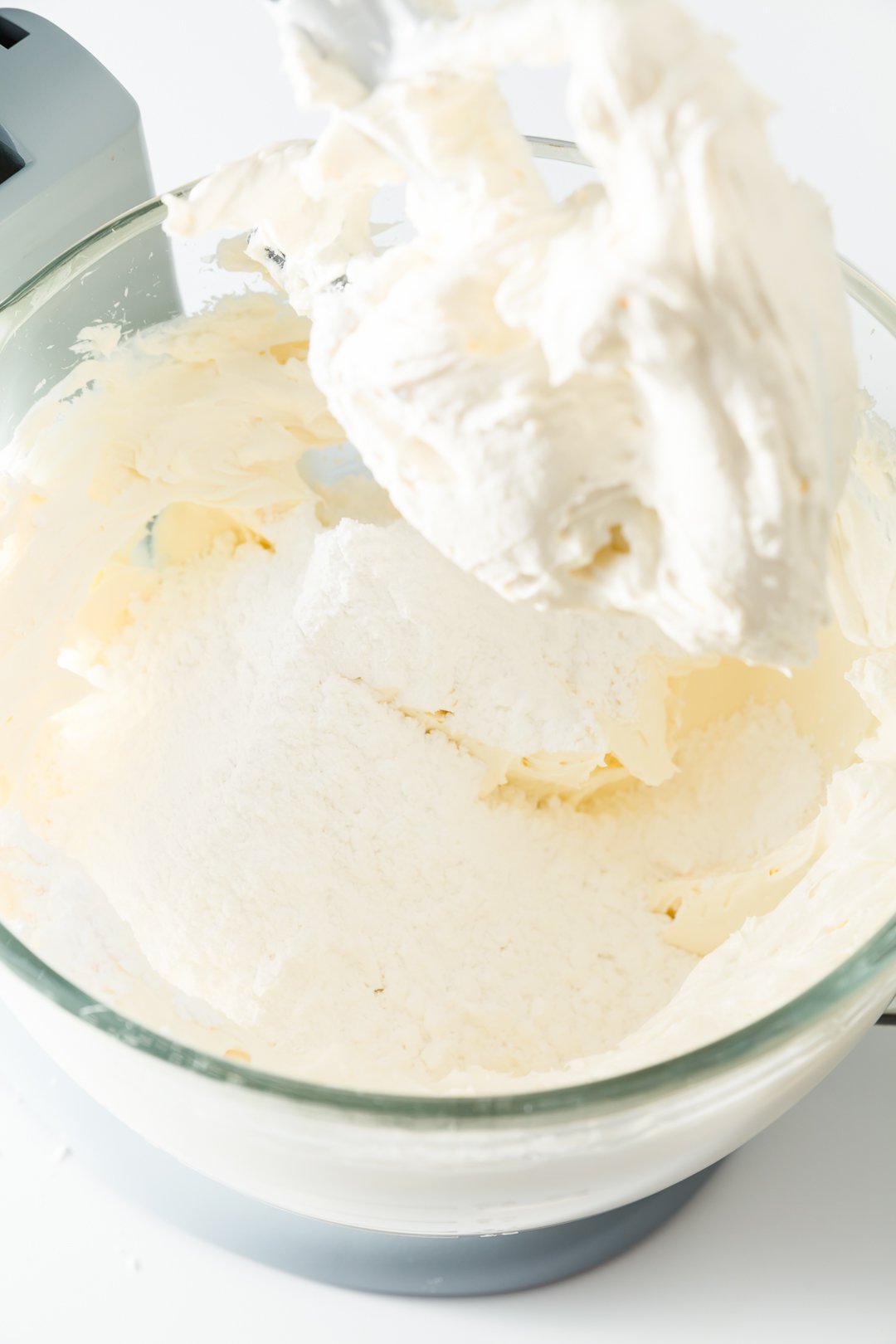 Adding powdered sugar to cream cheese frosting