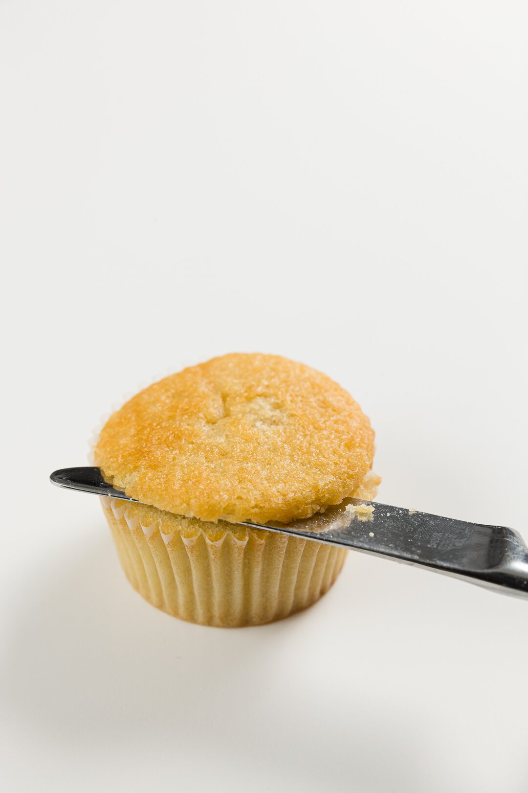 Cutting top off of a cupcake