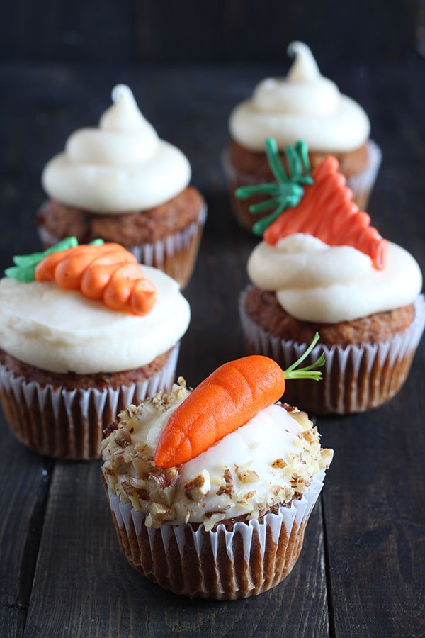 Cupcakes topped with three different types of carrots