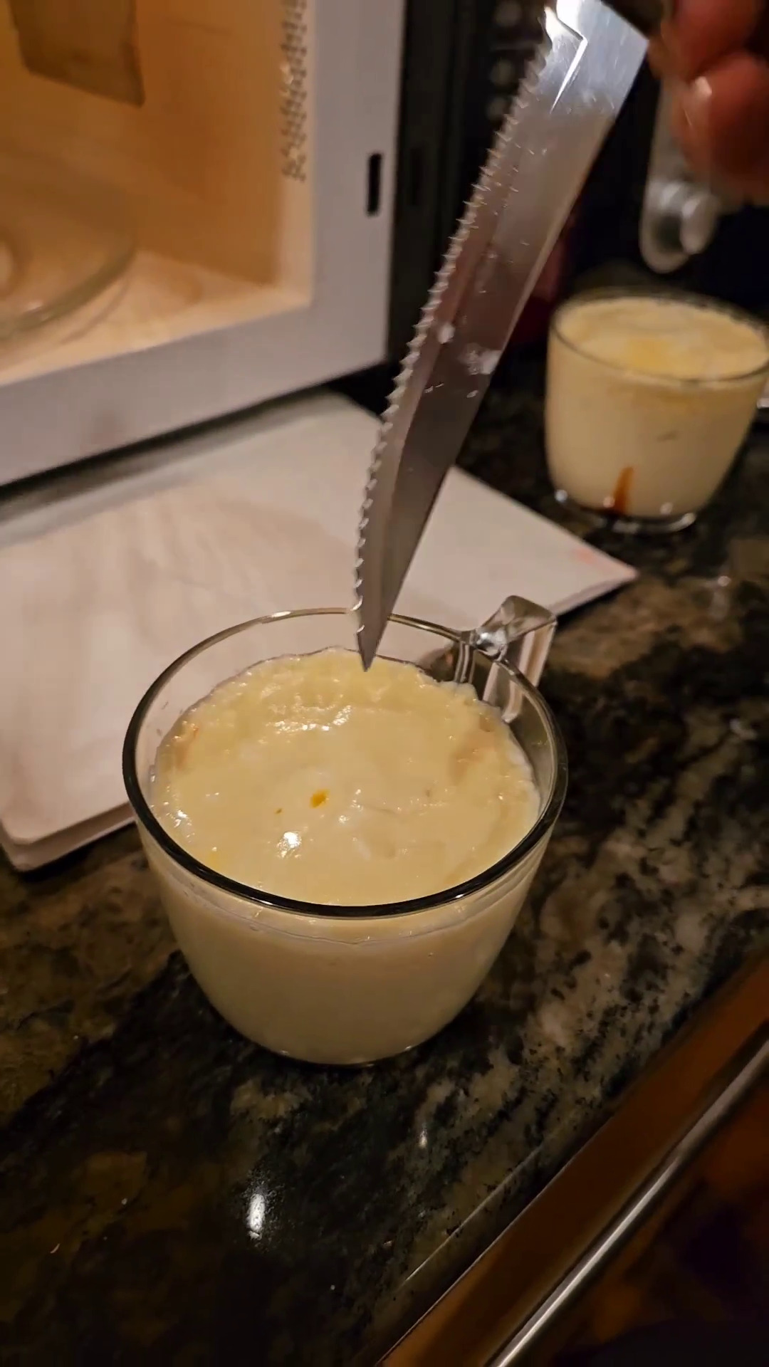 Using a knife to check for doneness.