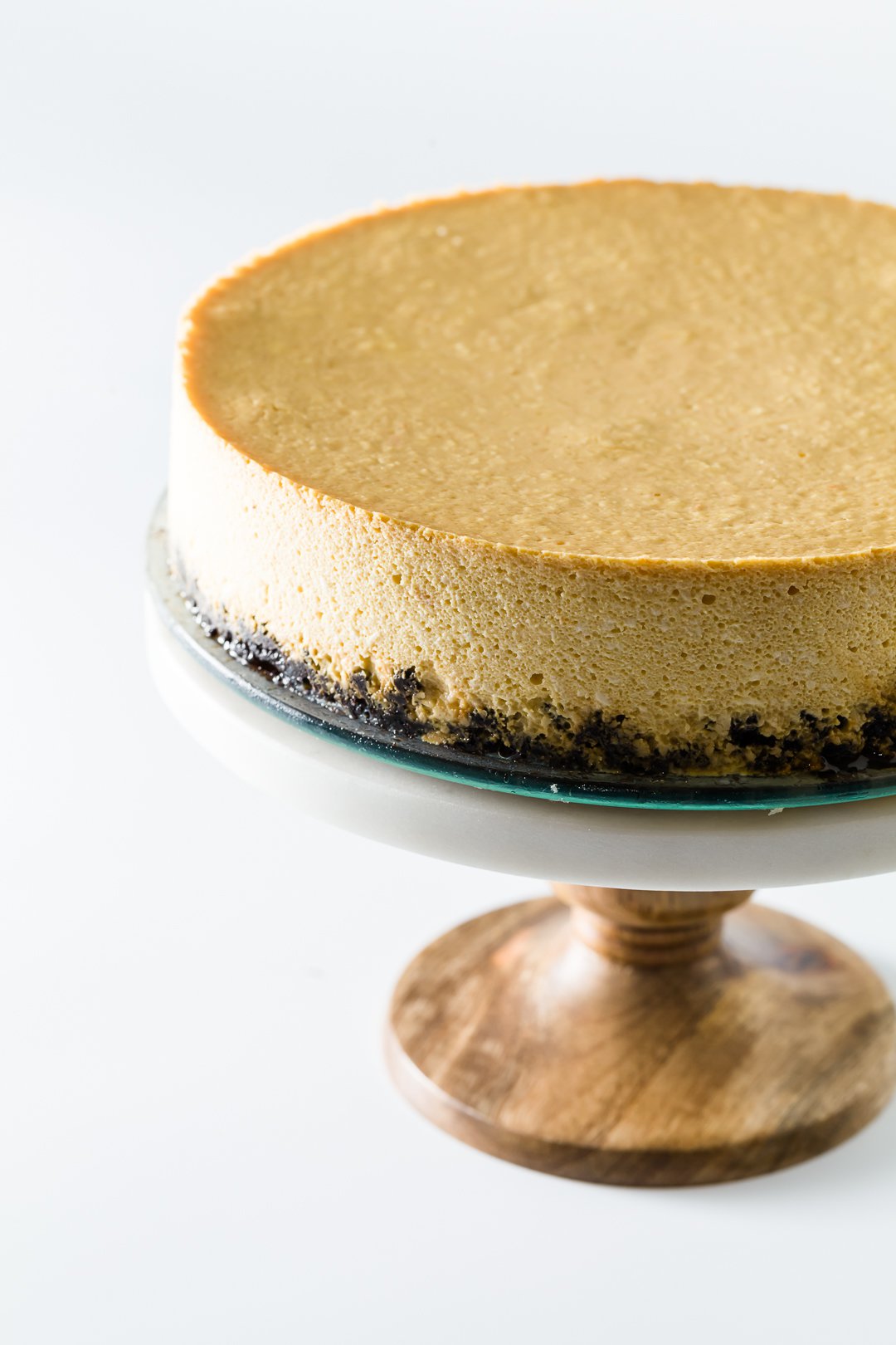 Orange cheesecake on a cake stand