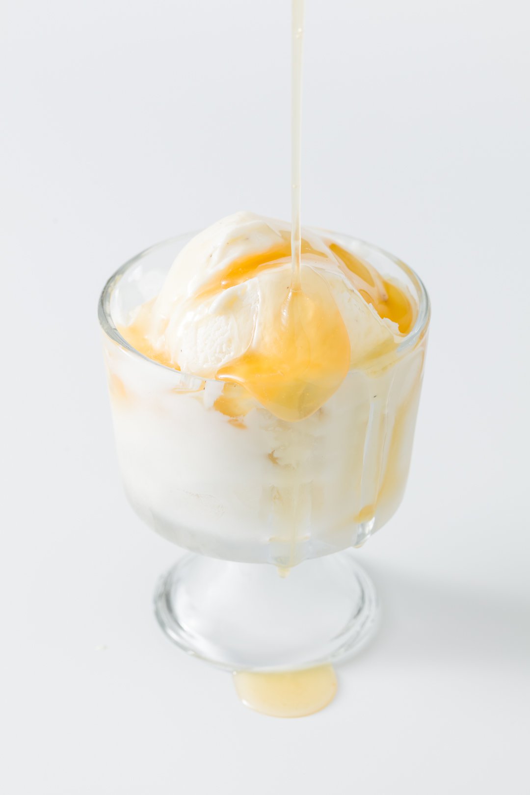 Orange sauce over ice cream