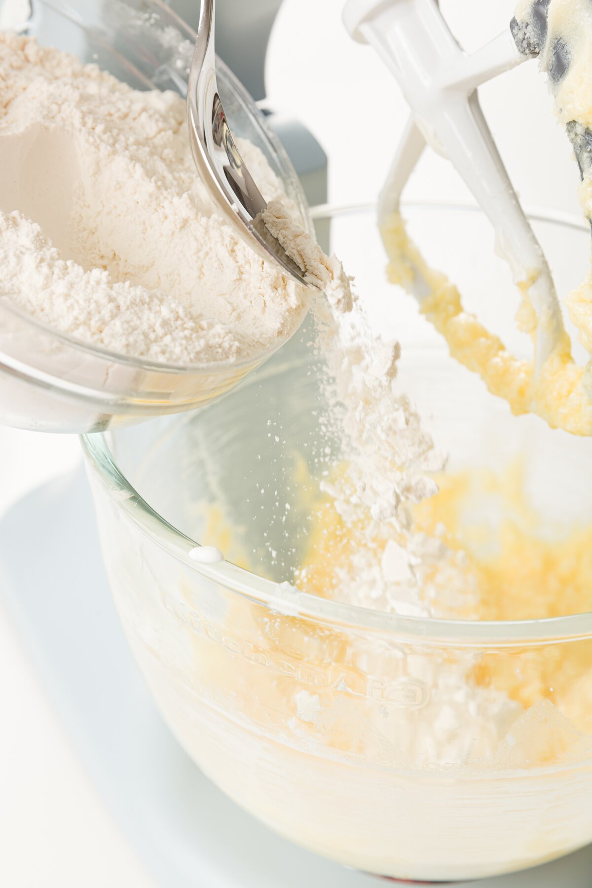 Adding dry ingredients to mixing bowl