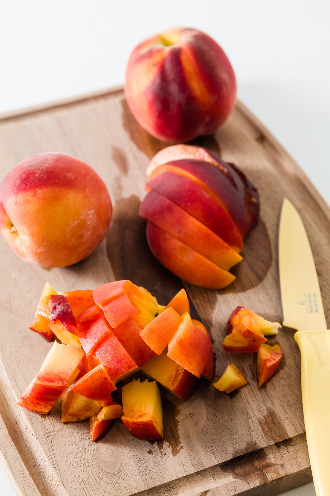 Chopped peaches on a cutting board