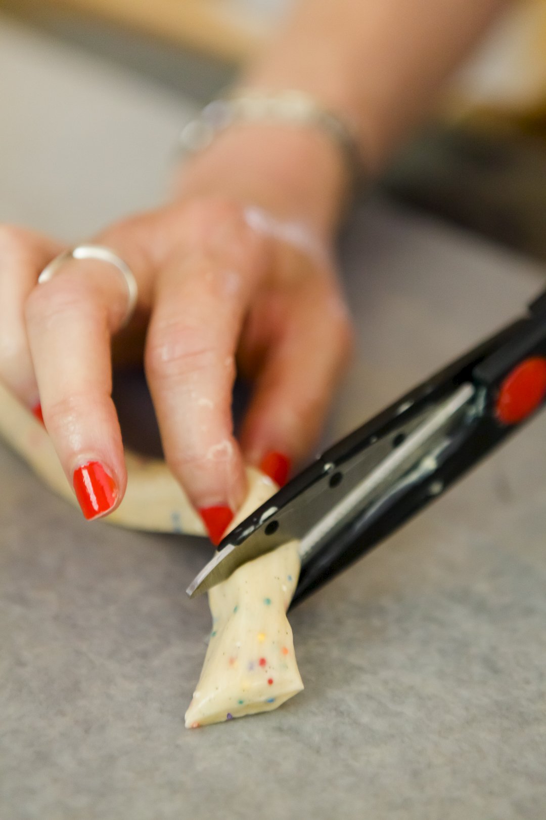 Cutting salt water taffy with scissors
