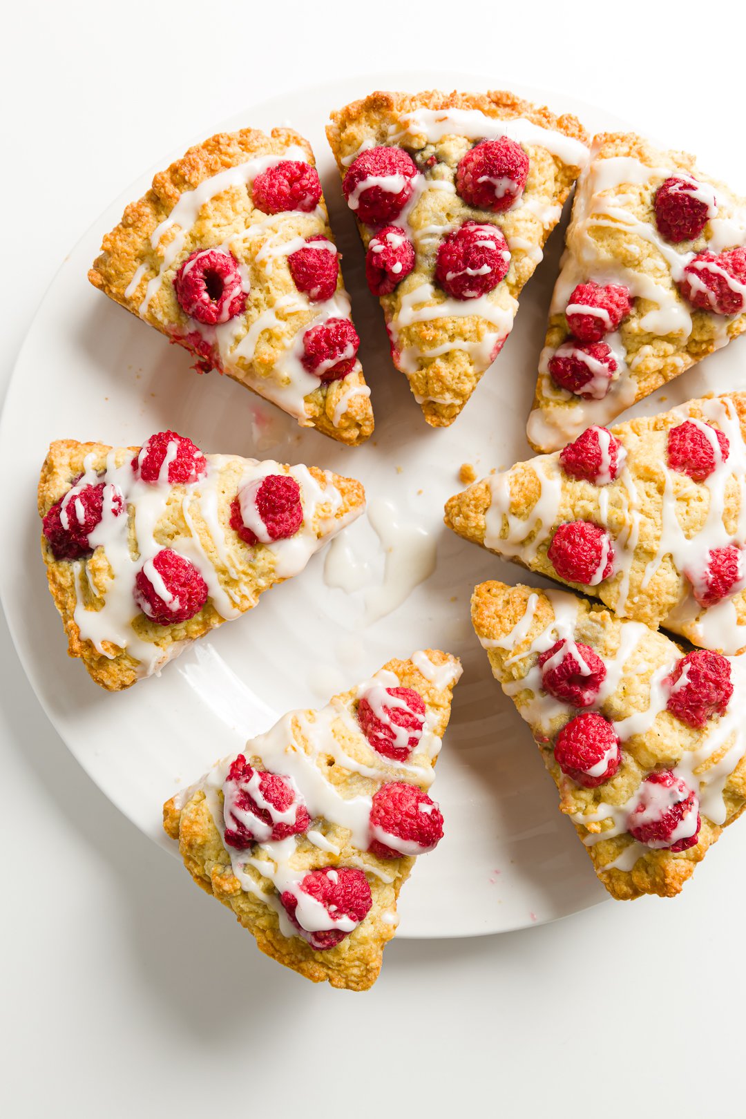 A plate filled with raspberry scones