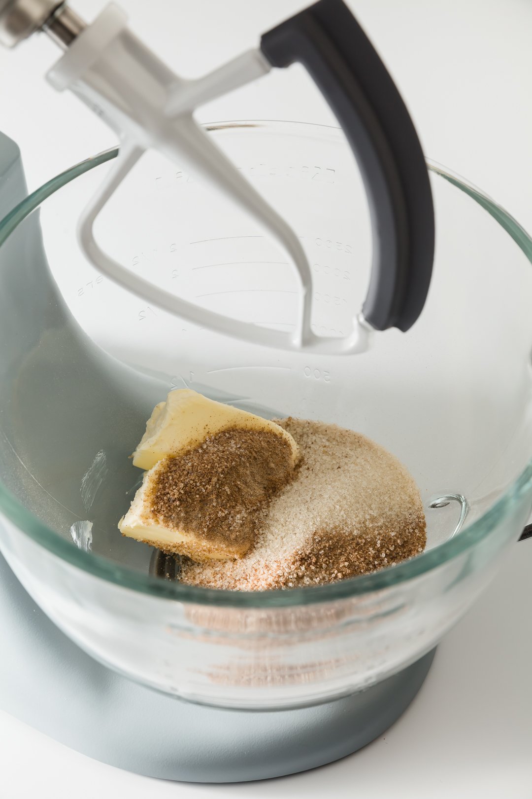 White sugar, brown sugar, and butter in the bowl of a stand mixer
