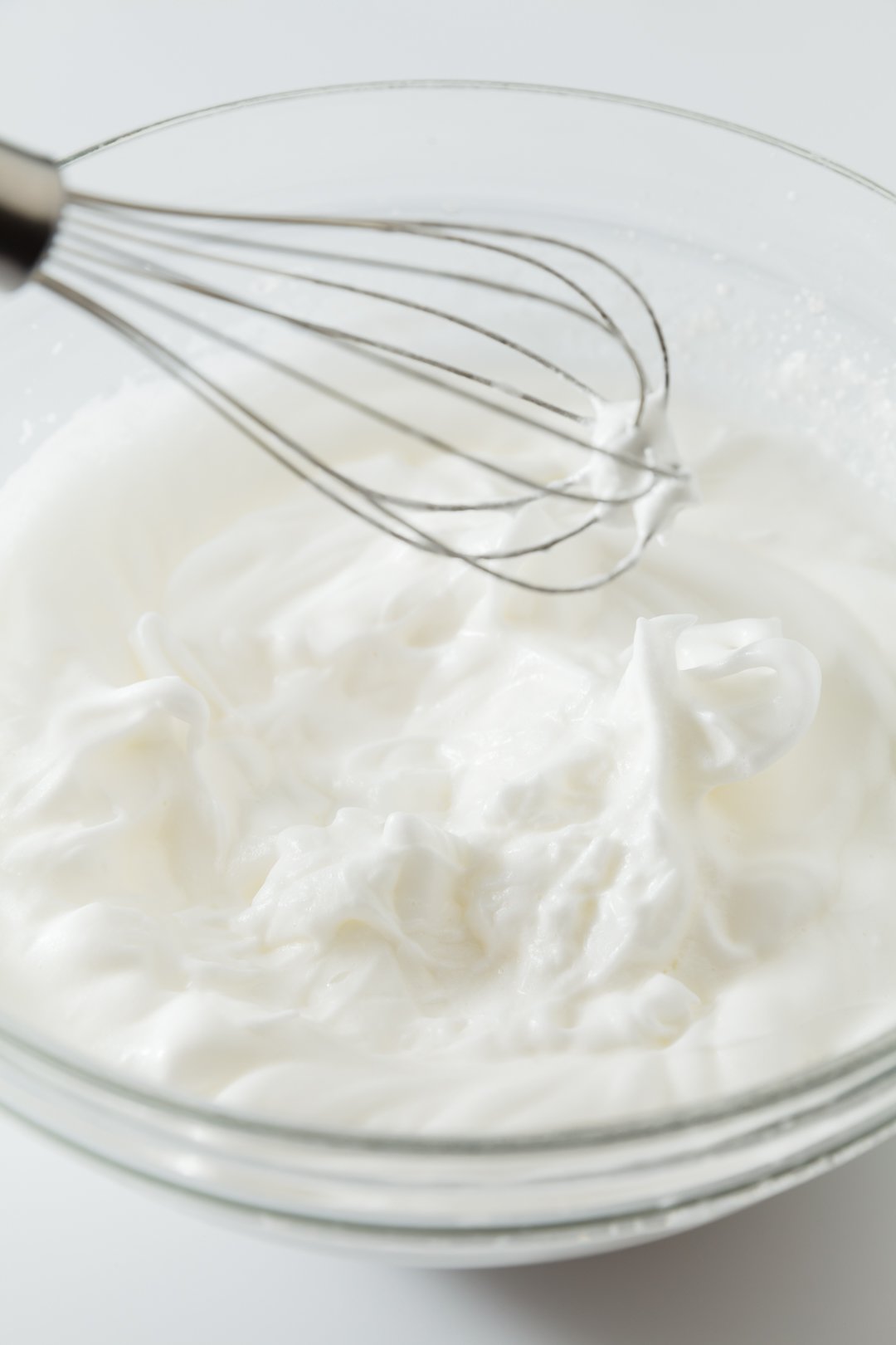 A bowl of egg whites beaten to stiff peaks