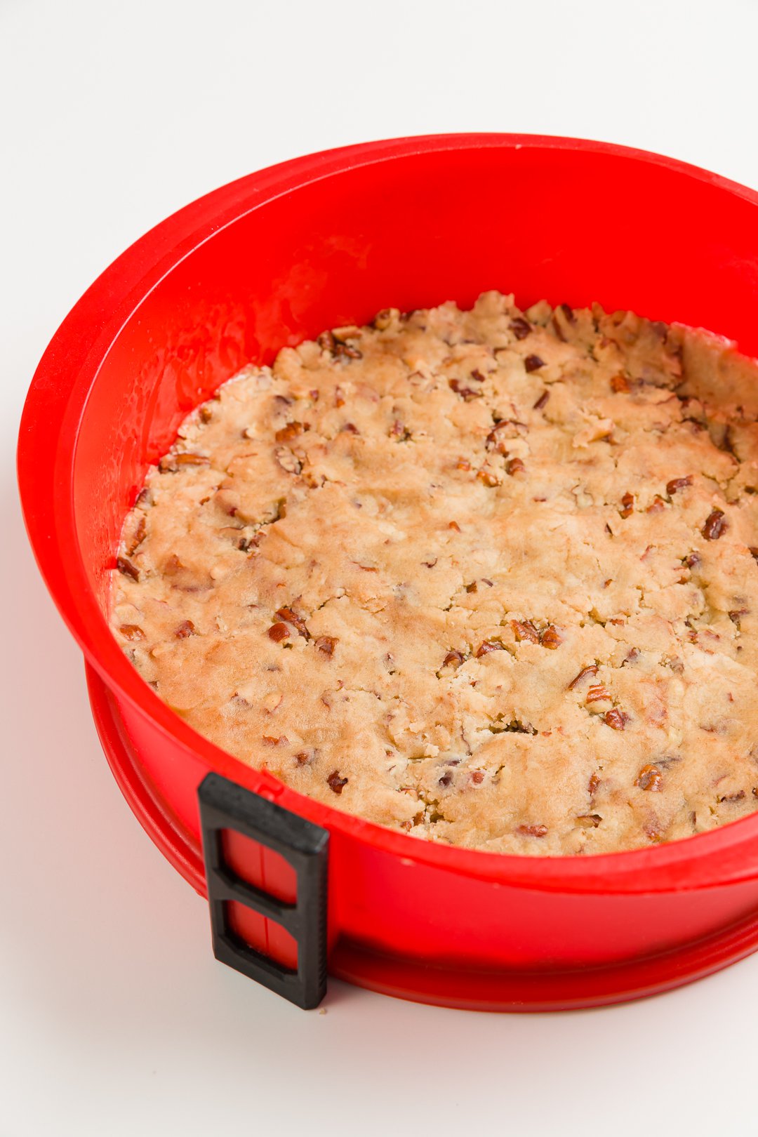 Brown sugar pecan crust in a springform pan