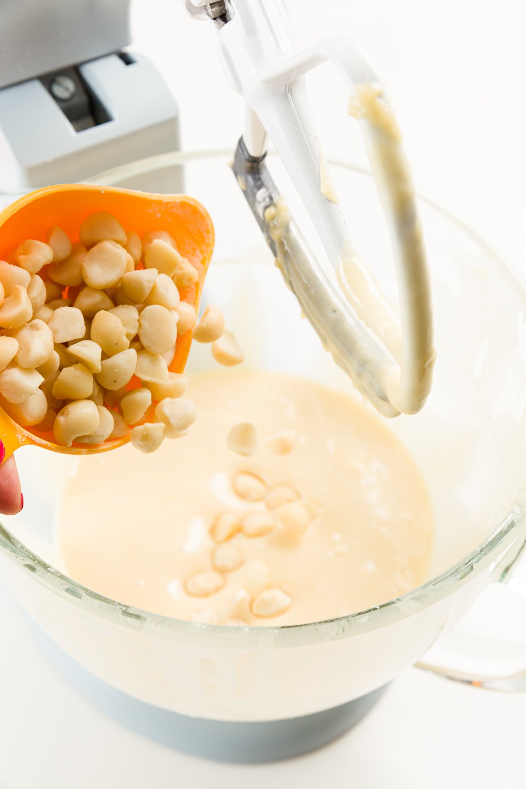 adding macadamia nuts to cupcake batter